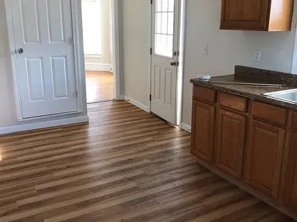 a view of a kitchen from the hallway