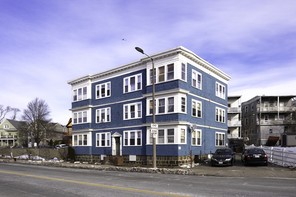 130 Talbot Avenue Boston, MA 02124 - Photo 2 of 3 a front view of a building with lot of cars and trees