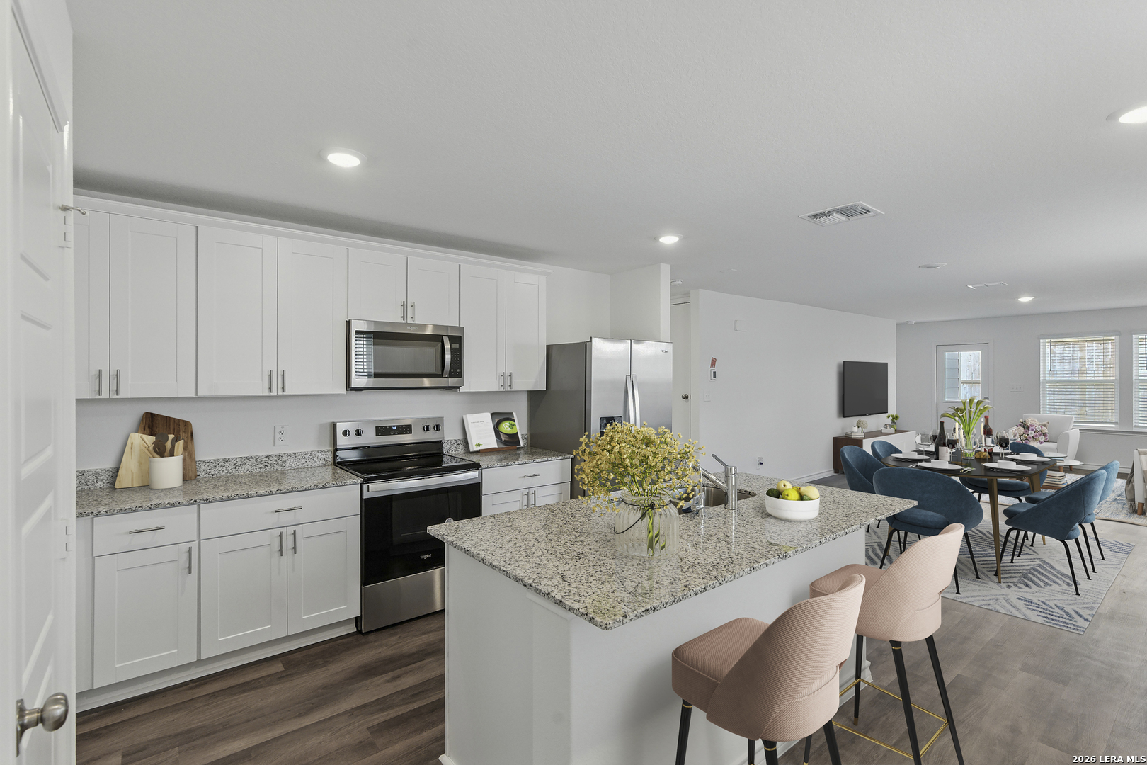 433 Raven Row Marion, TX 78124 - Photo 4 of 7 a kitchen with granite countertop a sink and cabinets