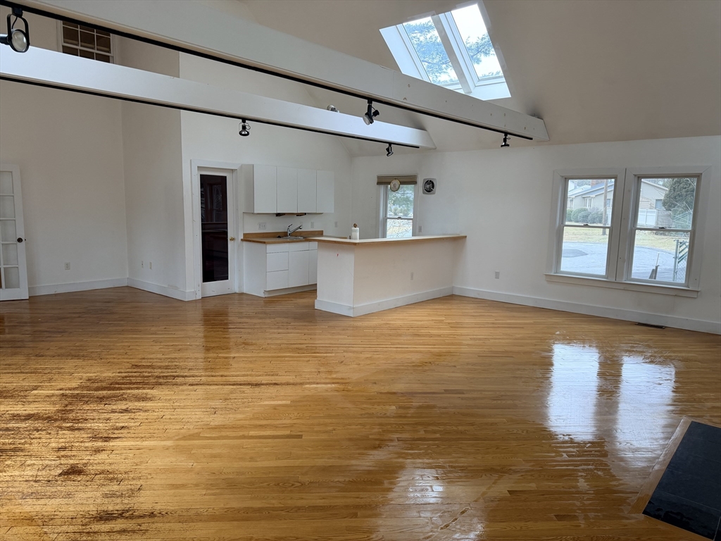 1 Nevada Road Burlington, MA 01803 - Photo 13 of 21 a view of a room with wooden floor and a window