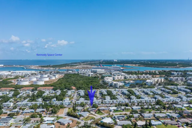 a bathroom with a granite countertop bathtub sink vanity mirror and toilet
