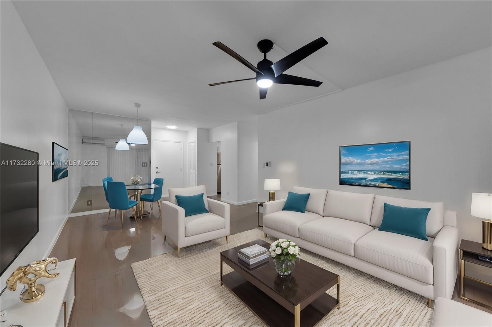 200 South Birch Road, Unit 103 Fort Lauderdale, FL 33316 - Photo 1 of 10 a living room with furniture and a flat screen tv
