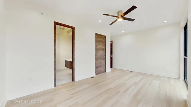 a bathroom with a granite countertop shower a sink and a mirror
