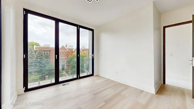 an entryway in a hall with a window