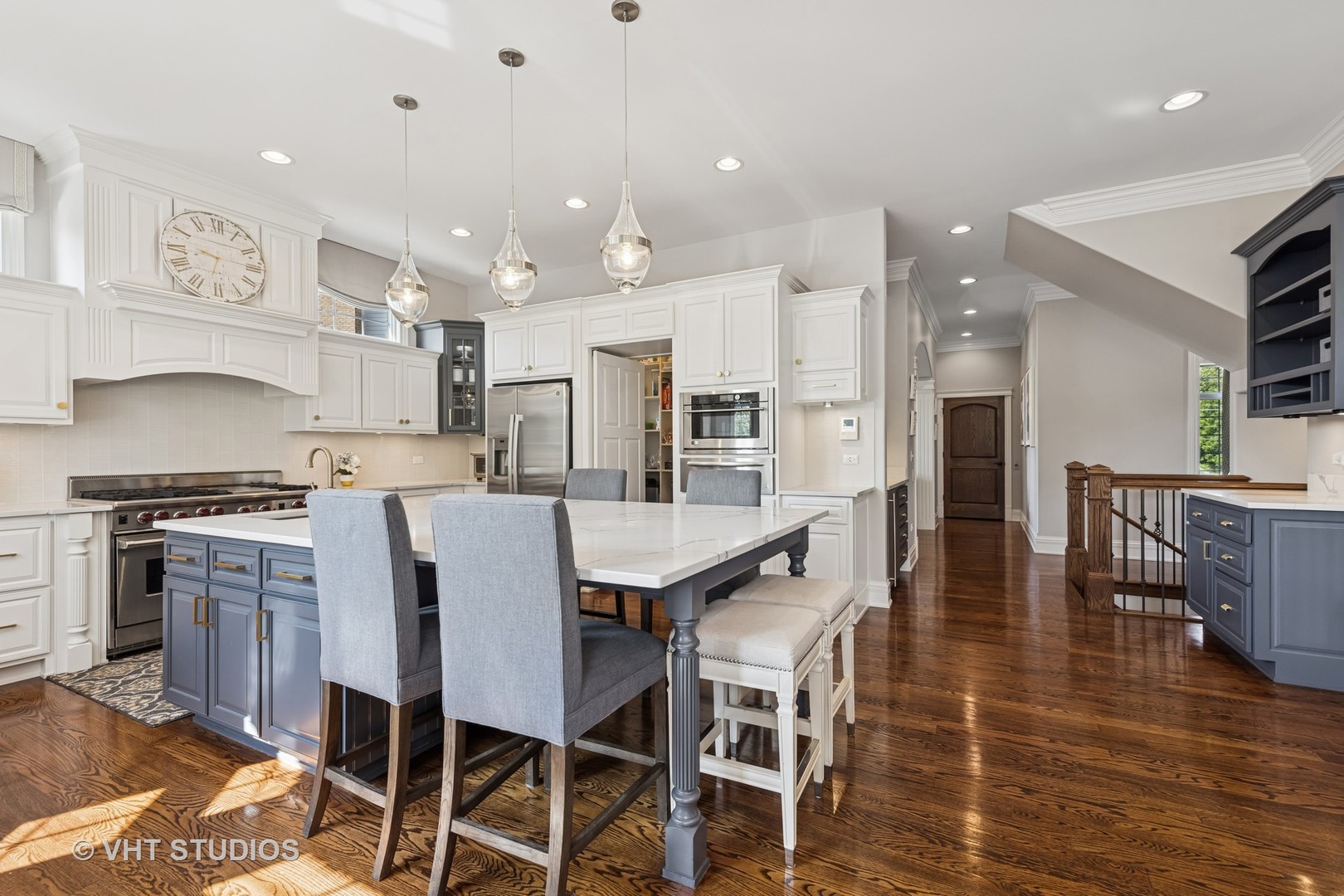 1227 Arnold Court Downers Grove, IL 60516 - Photo 24 of 72 a kitchen with stainless steel appliances granite countertop a stove top oven a sink a dining table and chairs