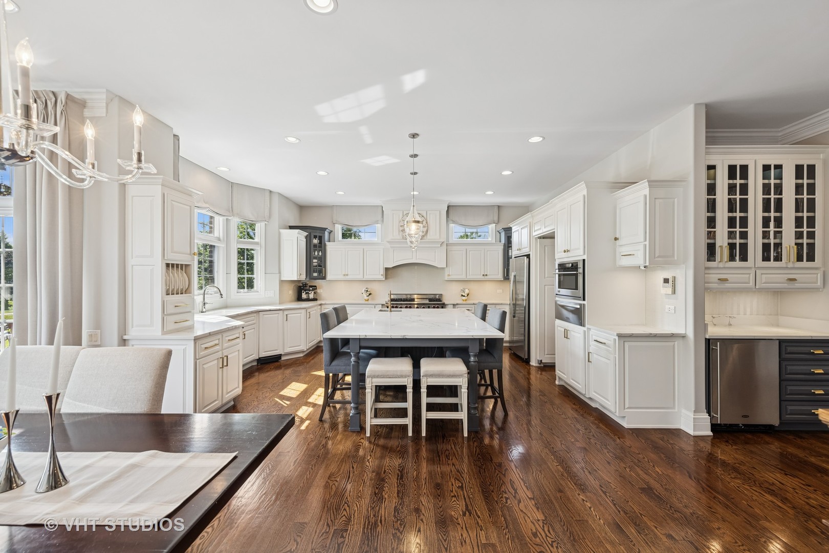 1227 Arnold Court Downers Grove, IL 60516 - Photo 25 of 72 a large kitchen with stainless steel appliances kitchen island granite countertop a large refrigerator a stove and white cabinets with wooden floor