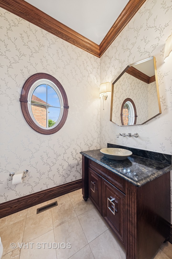1227 Arnold Court Downers Grove, IL 60516 - Photo 32 of 72 a bathroom with a granite countertop sink and a mirror