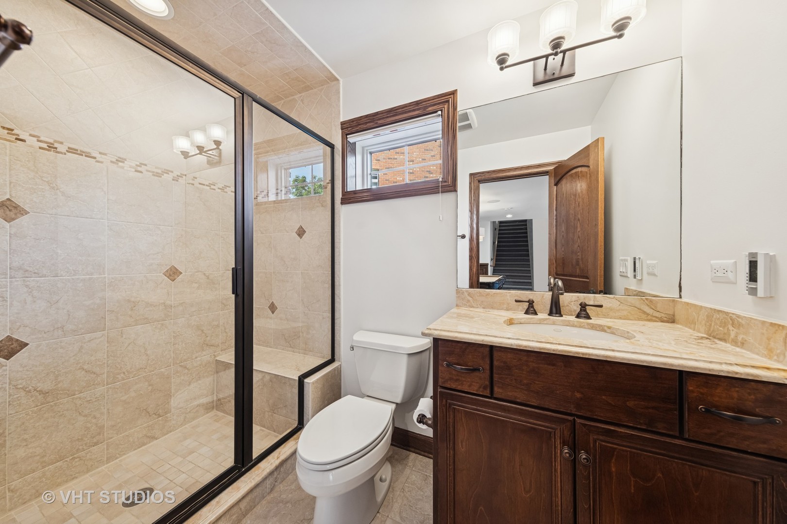 1227 Arnold Court Downers Grove, IL 60516 - Photo 34 of 72 a bathroom with a sink a toilet and shower
