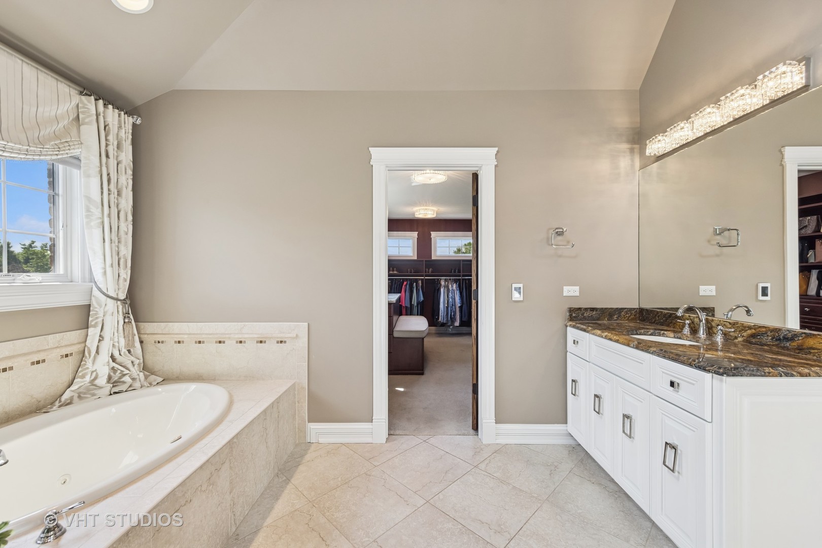 1227 Arnold Court Downers Grove, IL 60516 - Photo 47 of 72 a spacious bathroom with a tub sink and mirror