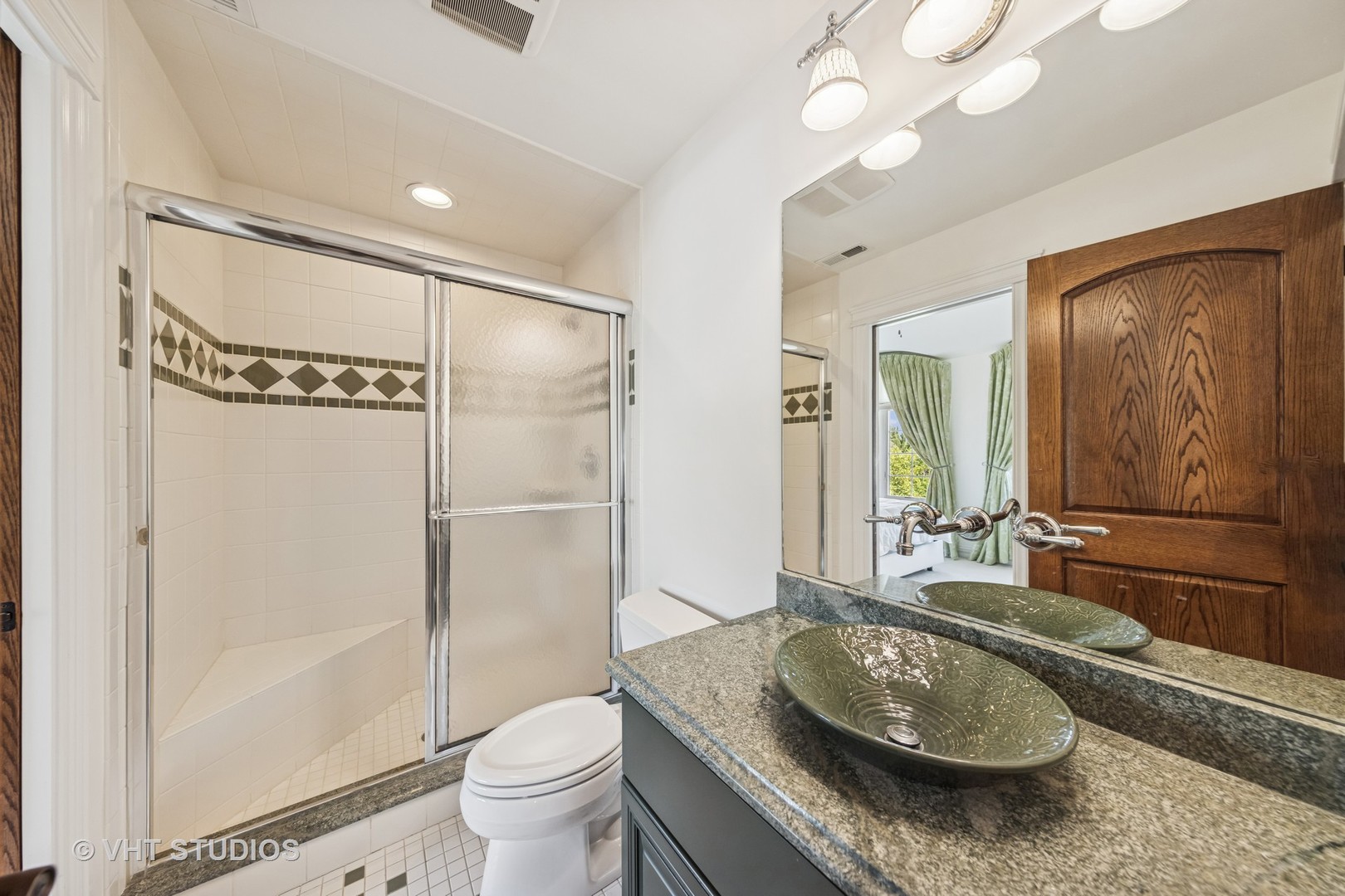 1227 Arnold Court Downers Grove, IL 60516 - Photo 53 of 72 a bathroom with a granite countertop sink a toilet a mirror and shower