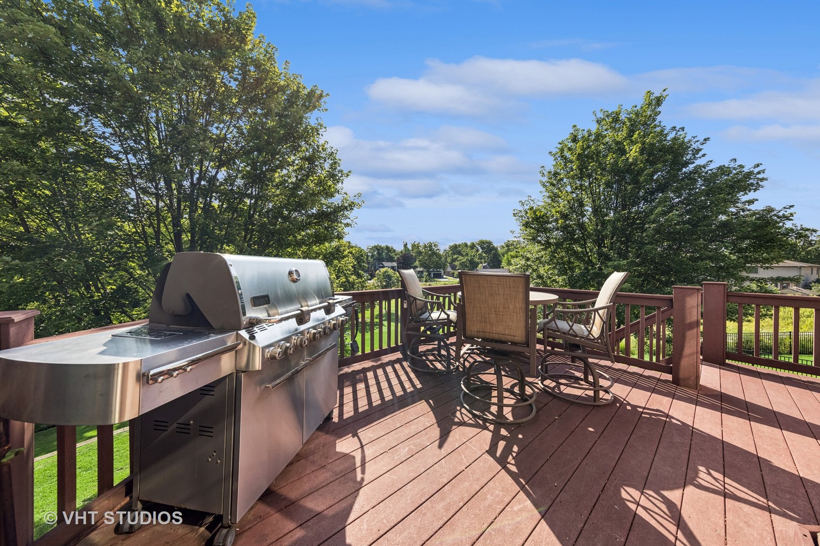 1227 Arnold Court Downers Grove, IL 60516 - Photo 58 of 72 a view of a roof deck with table and chairs couches with wooden floor and fence