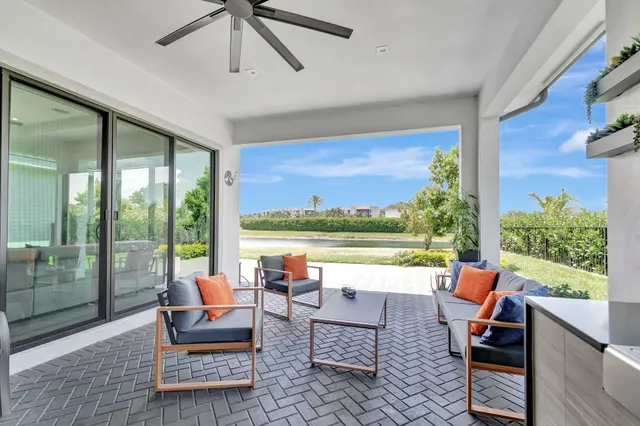 a view of a livingroom with furniture and a ceiling fan