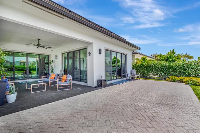 a view of a hallway with closet and a door