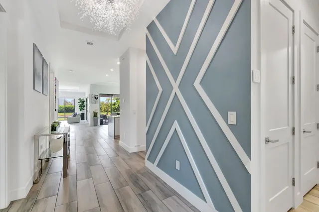 a view of entryway and hall with wooden floor