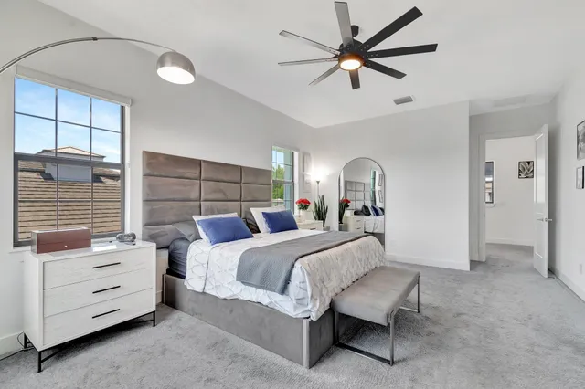 a bathroom with a sink mirror and a shower