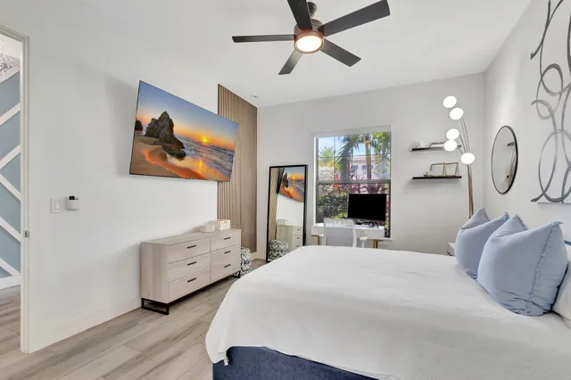 a bathroom with a double vanity sink toilet and shower