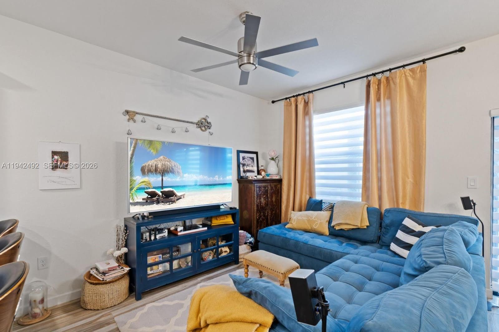 3304 West 92nd Place Hialeah, FL 33018 - Photo 12 of 34 a living room with furniture and a window