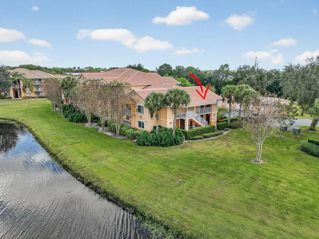 a view of a garden with a building in the background