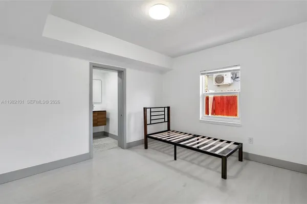 a view of an empty room and window