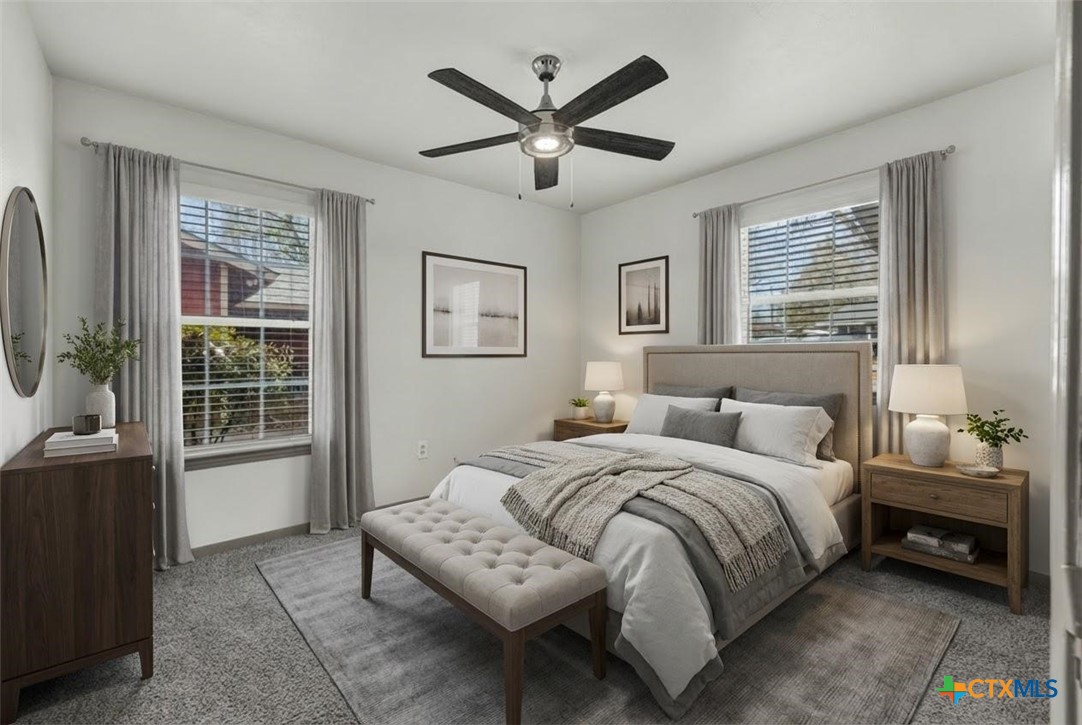 313 Armstrong Street San Marcos, TX 78666 - Photo 13 of 25 a bedroom with a bed and a large window