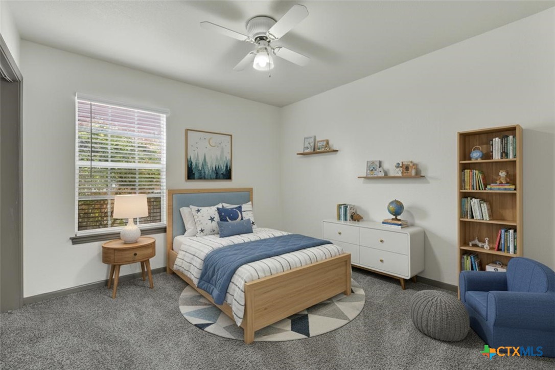 313 Armstrong Street San Marcos, TX 78666 - Photo 14 of 25 a bedroom with a bed furniture and a window