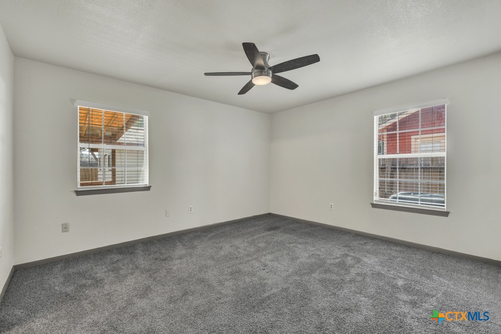 313 Armstrong Street San Marcos, TX 78666 - Photo 17 of 25 a view of an empty room with a window