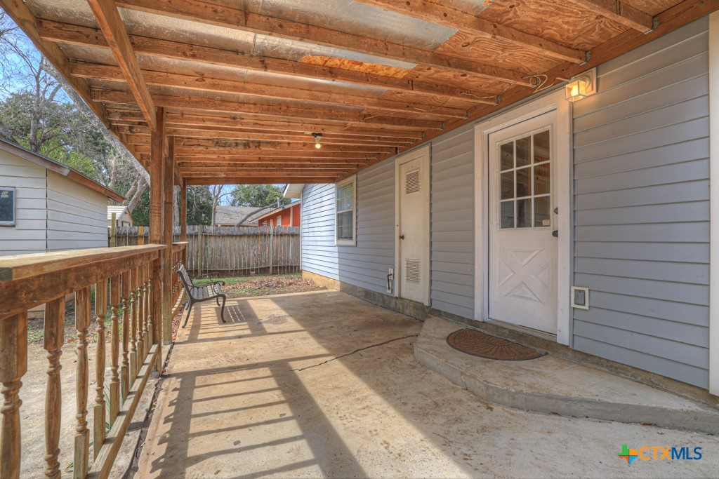 313 Armstrong Street San Marcos, TX 78666 - Photo 20 of 25 a view of a porch with wooden floor