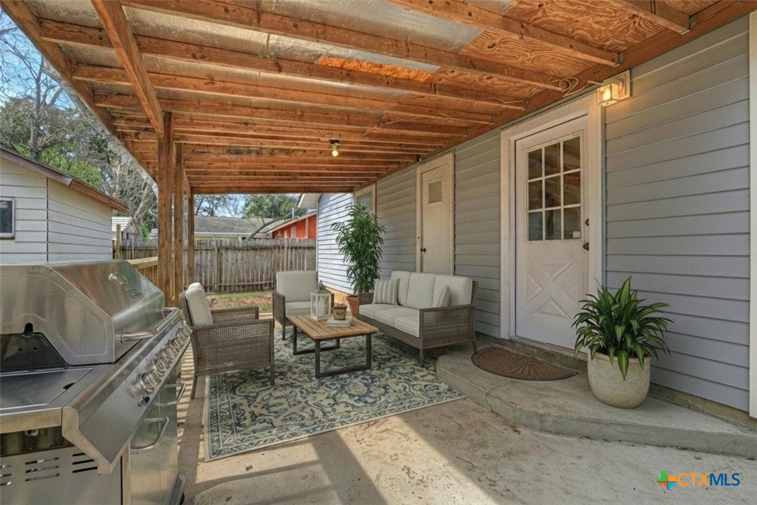 313 Armstrong Street San Marcos, TX 78666 - Photo 21 of 25 a view of a patio with couches and potted plants