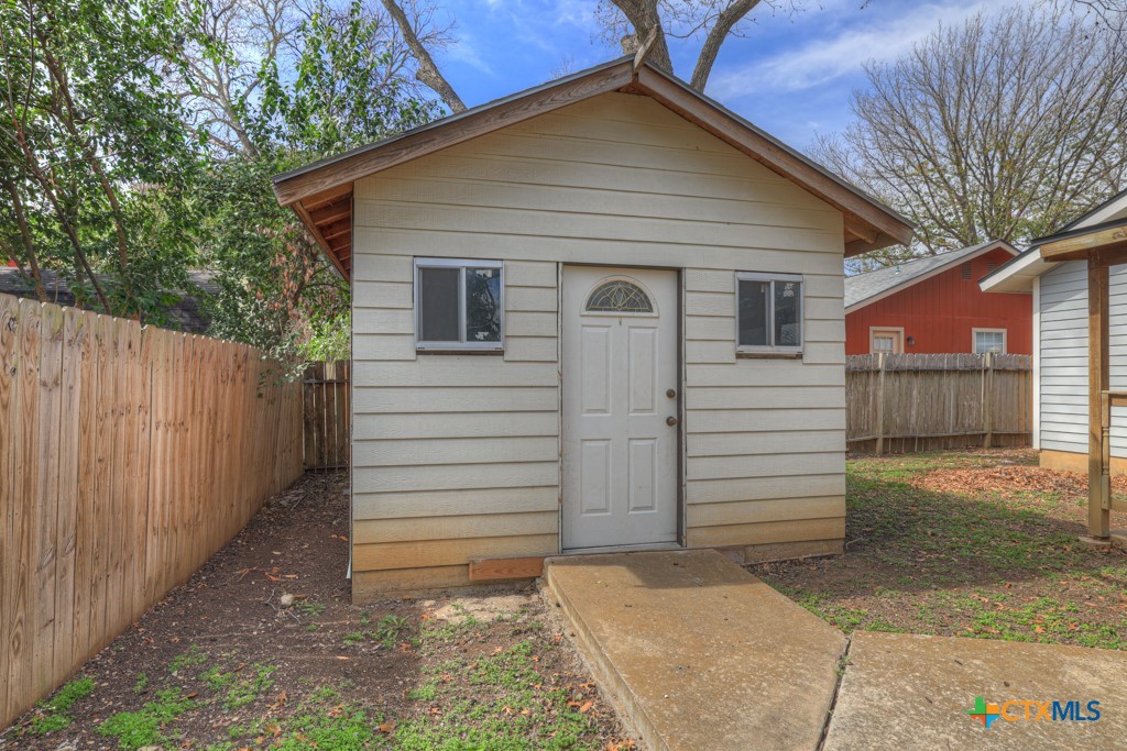 313 Armstrong Street San Marcos, TX 78666 - Photo 25 of 25 a view of a house with a yard