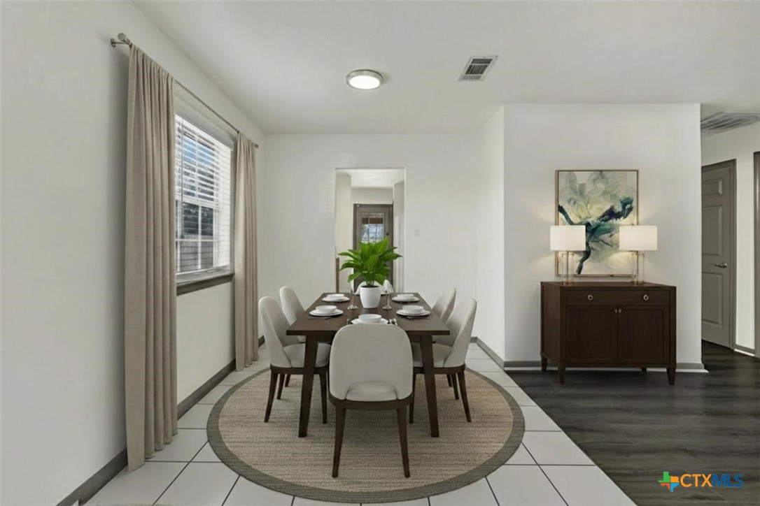 313 Armstrong Street San Marcos, TX 78666 - Photo 8 of 25 a view of a dining room with furniture window and wooden floor