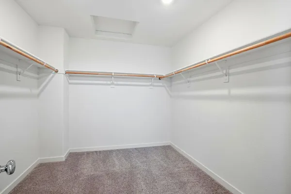 a view of an empty walk in closet