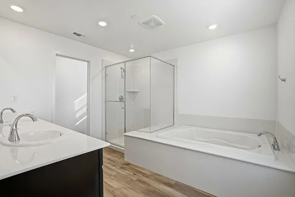 a bathroom with a bathtub and a sink