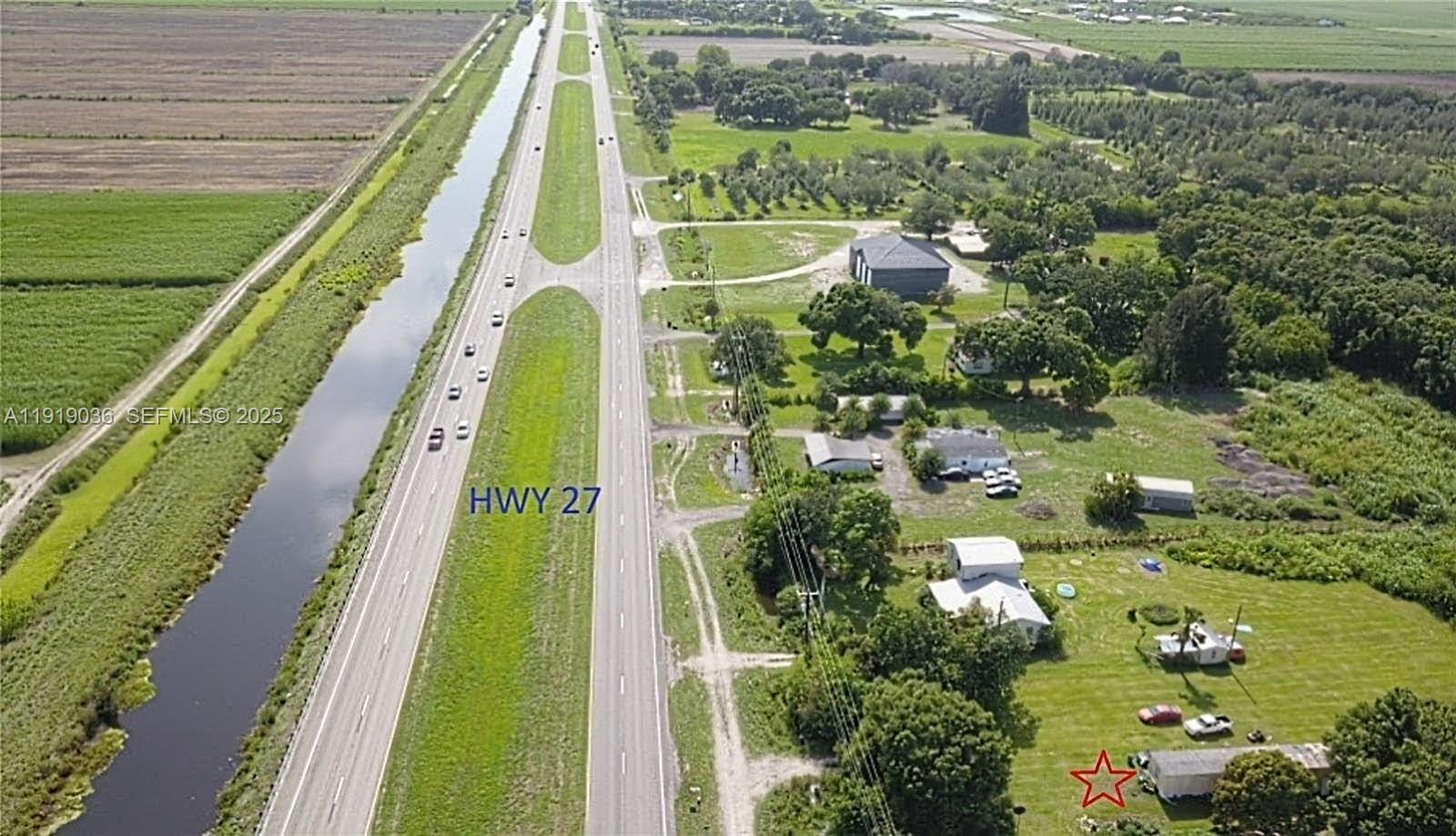 2834 Highway 27 Clewiston, FL 33440 - Photo 1 of 5 a view of swimming pool with a balcony