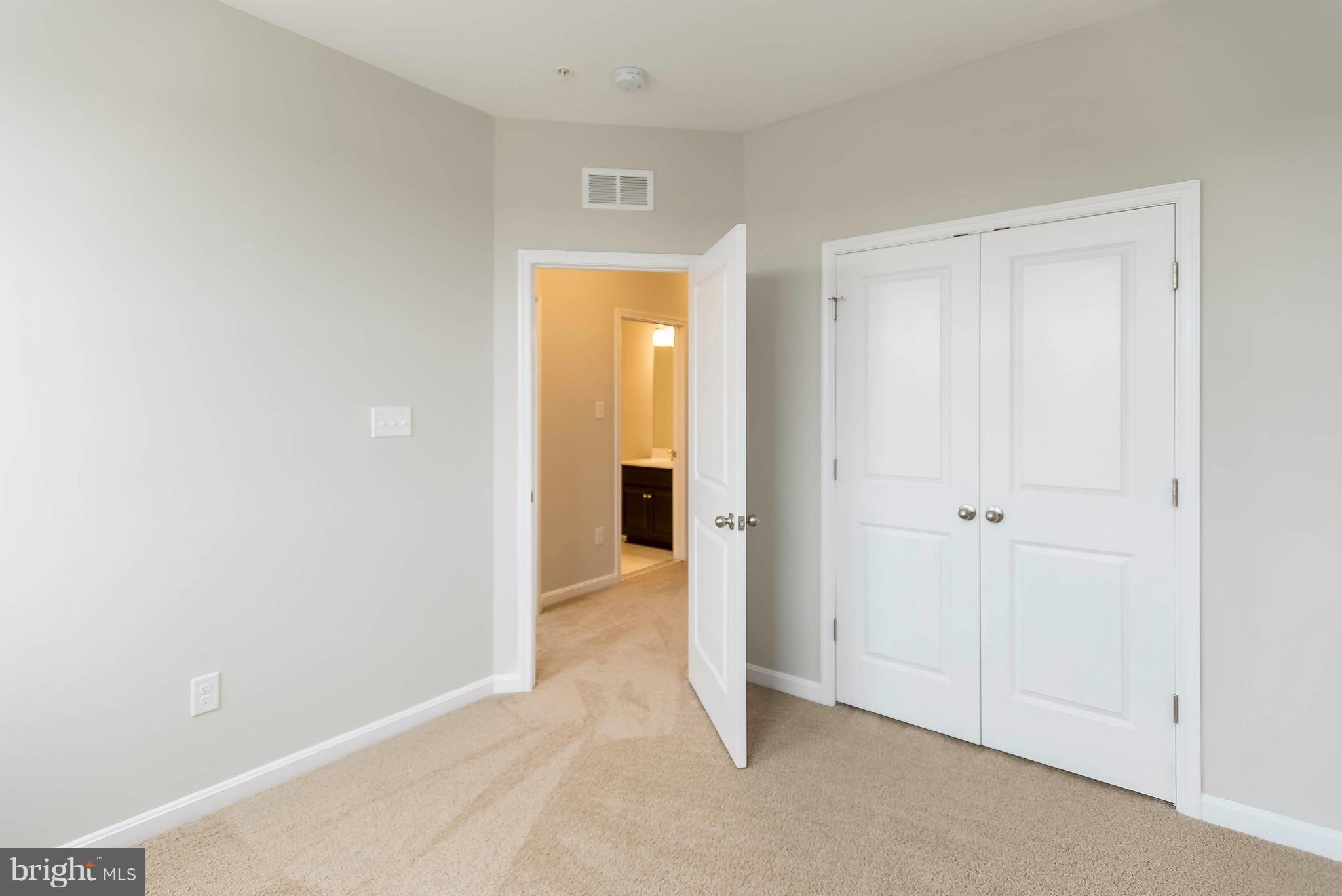 4609 Cambria Road Frederick, MD 21703 - Photo 25 of 29 a view of an empty room with closet and a window