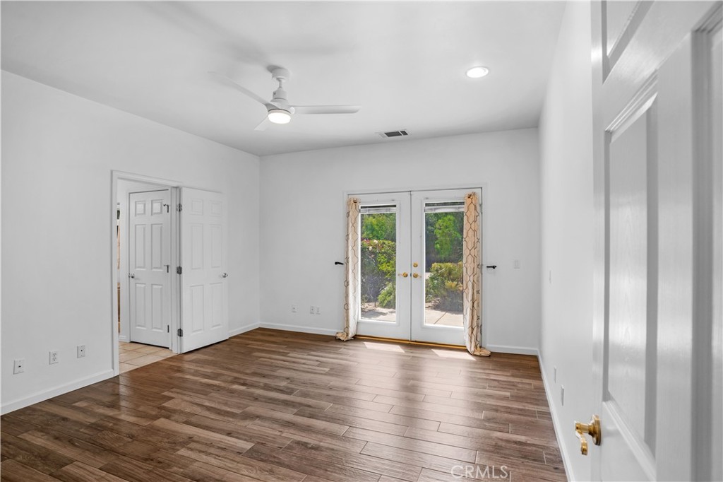 29781 Pasada Road Temecula, CA 92591 - Photo 27 of 58 Primary bedroom with doors opening to front courtyard