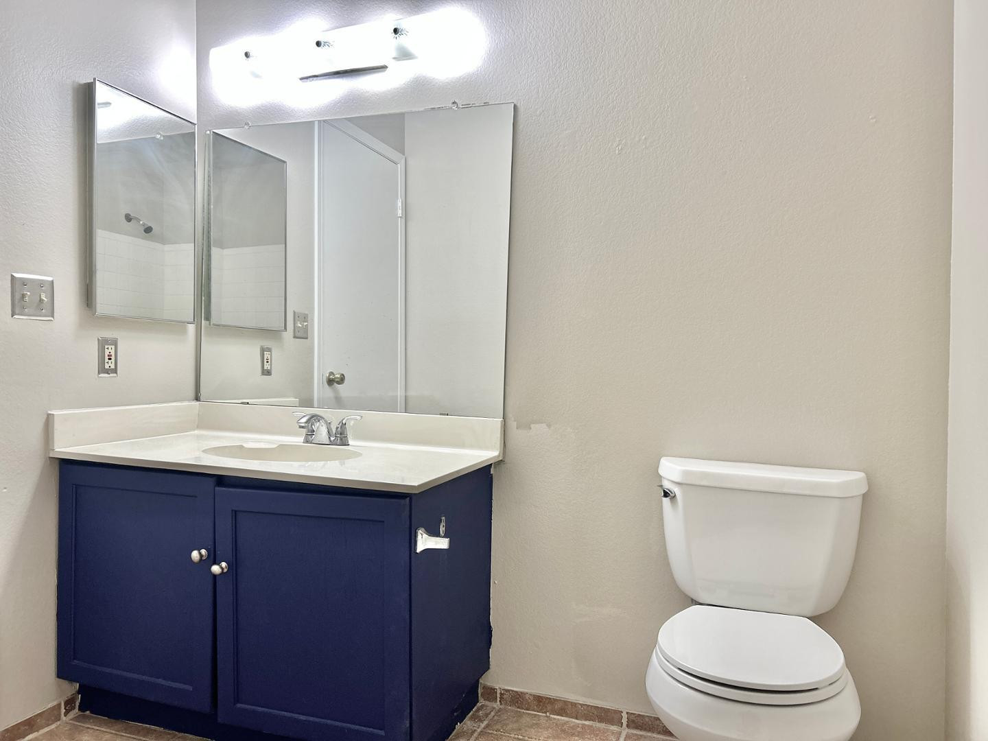6143 West Del Rio Street Chandler, AZ 85226 - Photo 16 of 19 a bathroom with a toilet a sink and mirror