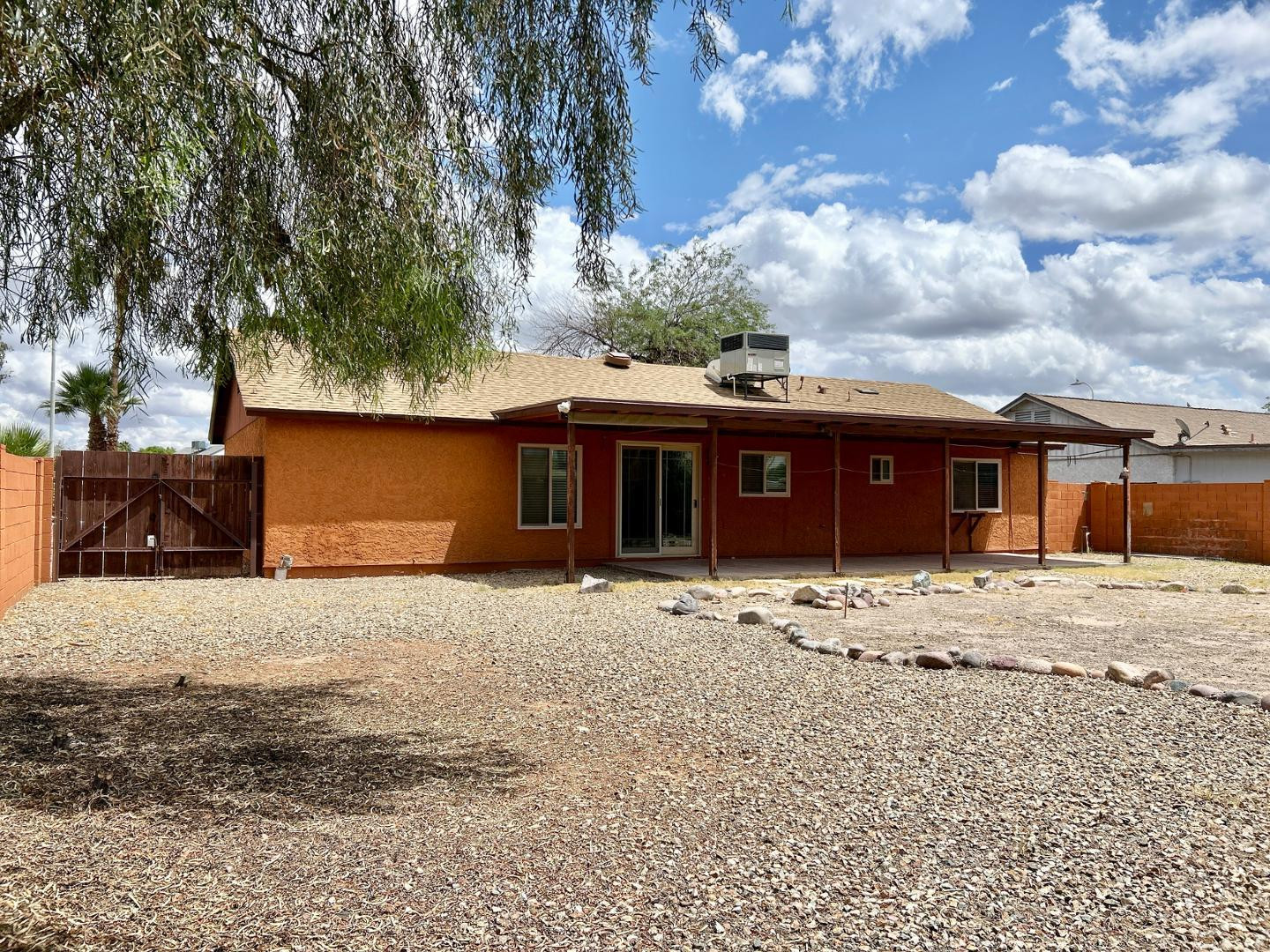 6143 West Del Rio Street Chandler, AZ 85226 - Photo 17 of 19 a front view of a house with a yard and trees