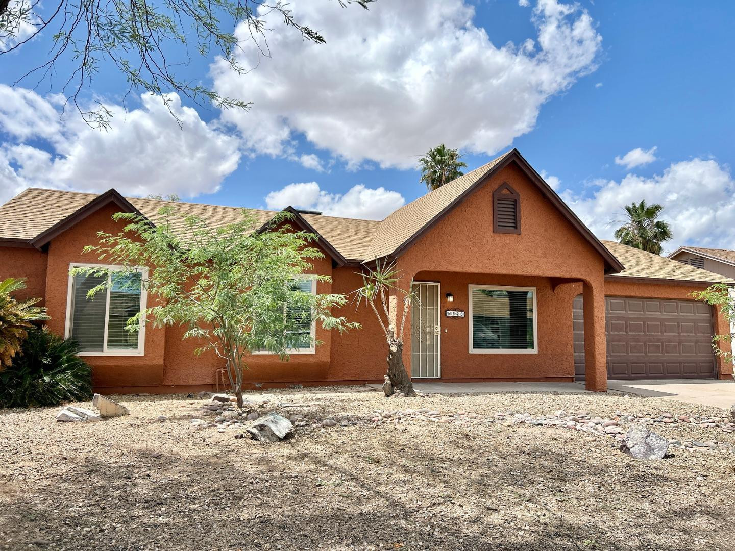 6143 West Del Rio Street Chandler, AZ 85226 - Photo 2 of 19 a front view of a house with a yard and garage