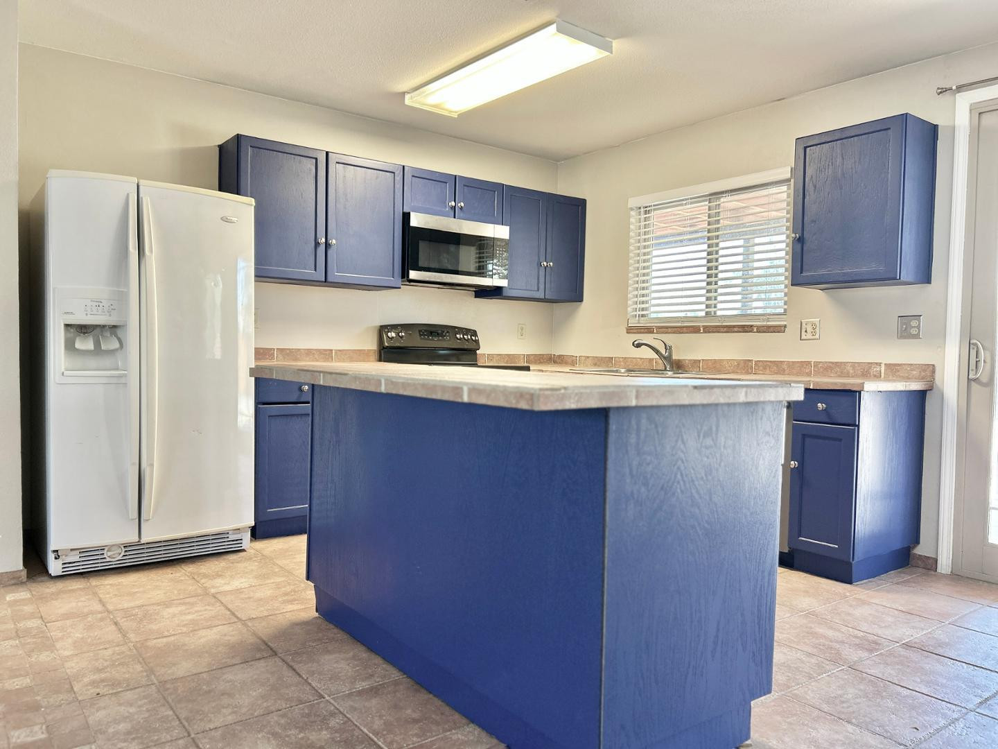 6143 West Del Rio Street Chandler, AZ 85226 - Photo 6 of 19 a kitchen with stainless steel appliances granite countertop a refrigerator a sink a stove a microwave and wooden cabinets