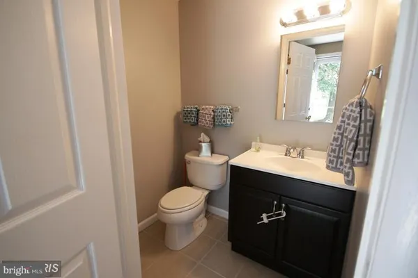 a bedroom with a bed and a potted plant