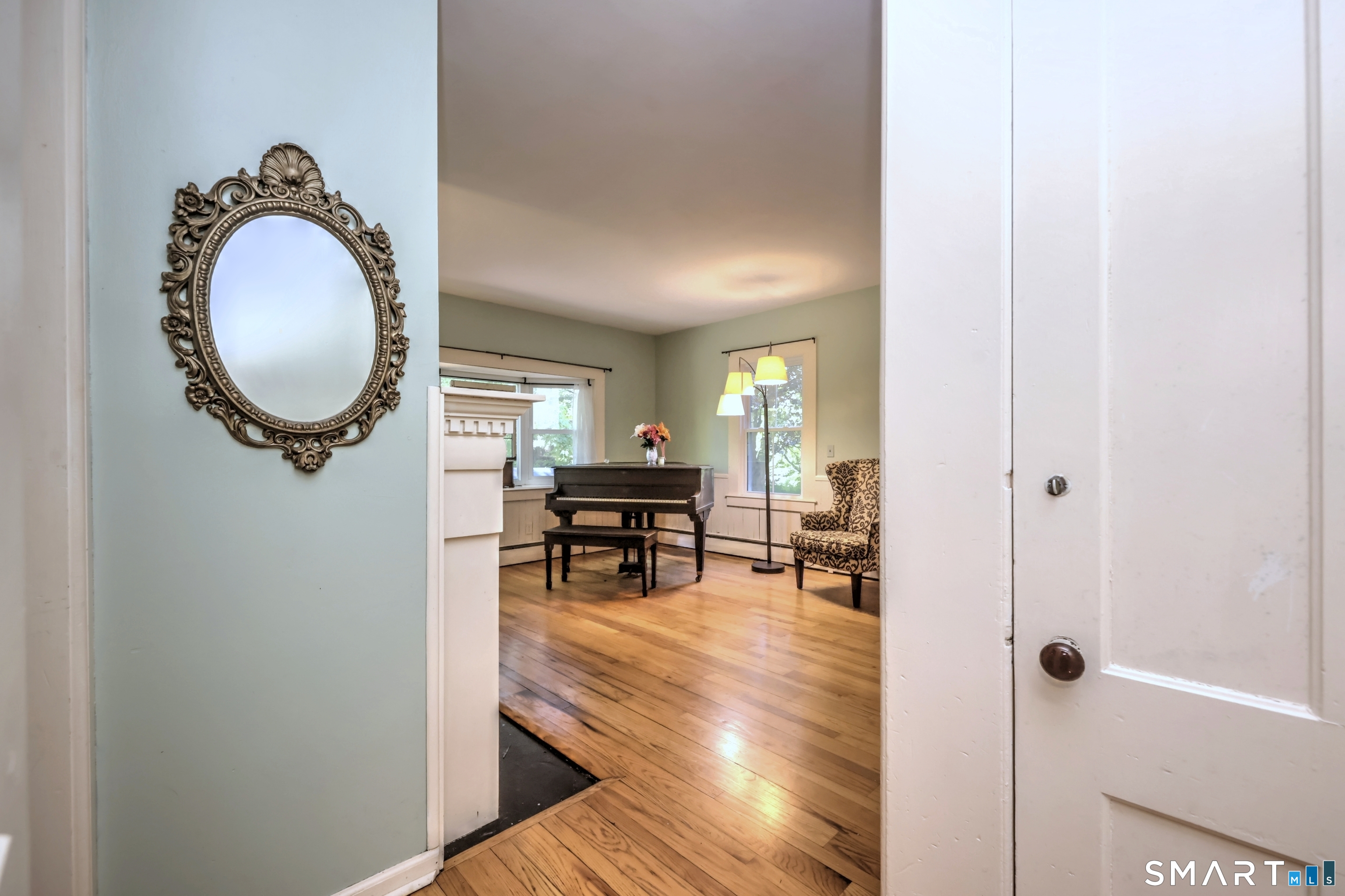 186 Jones Hill Road West Haven, CT 06516 - Photo 16 of 33 a living room with furniture and a mirror