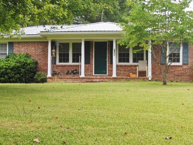 1235 Girl Scout Road Lizella, GA 31052 - Photo 2 of 29 a front view of house with outdoor seating and yard
