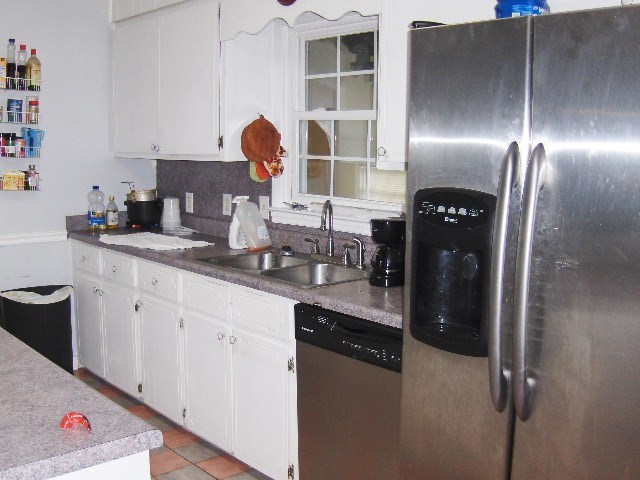 1235 Girl Scout Road Lizella, GA 31052 - Photo 11 of 29 a kitchen with stainless steel appliances granite countertop a refrigerator and a sink