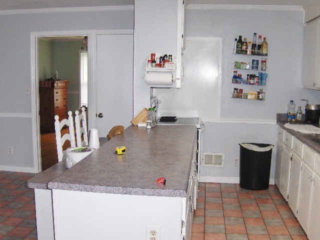 1235 Girl Scout Road Lizella, GA 31052 - Photo 13 of 29 a room with a table and couch