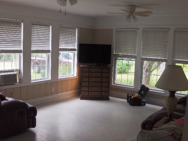 1235 Girl Scout Road Lizella, GA 31052 - Photo 19 of 29 a living room with furniture and a flat screen tv