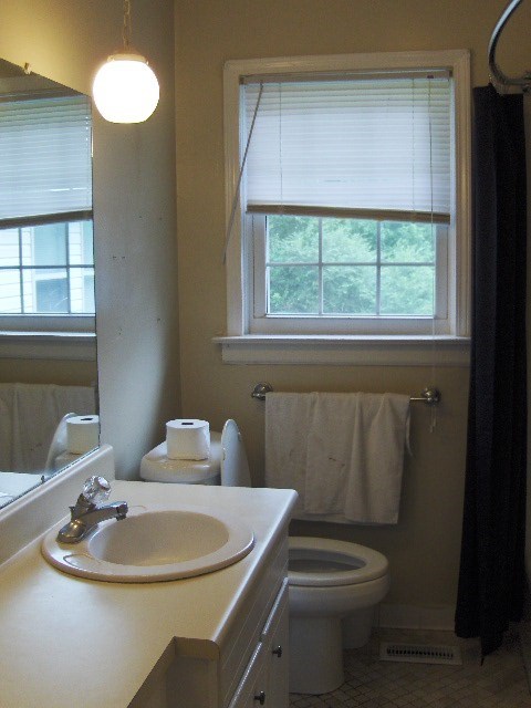 1235 Girl Scout Road Lizella, GA 31052 - Photo 23 of 29 a bathroom with a toilet sink and mirror