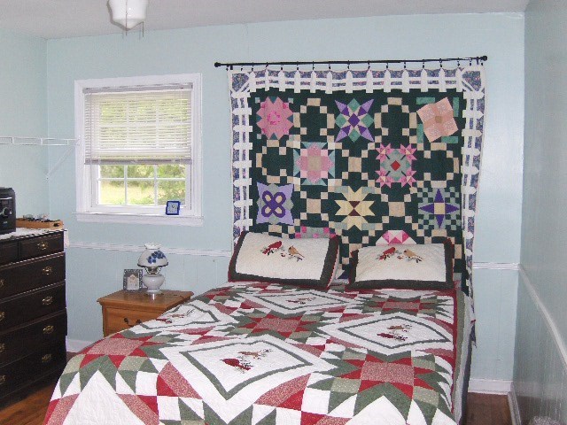 1235 Girl Scout Road Lizella, GA 31052 - Photo 24 of 29 a bedroom with a bed and a window