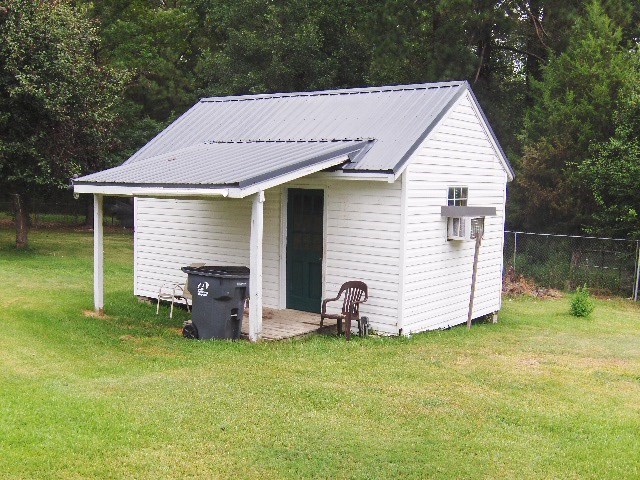 1235 Girl Scout Road Lizella, GA 31052 - Photo 26 of 29 a view of a house with backyard