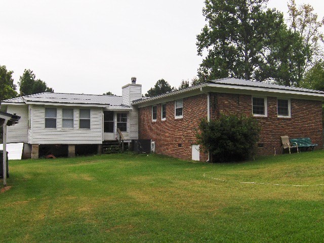1235 Girl Scout Road Lizella, GA 31052 - Photo 28 of 29 a view of a house with a yard