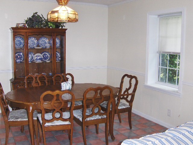 1235 Girl Scout Road Lizella, GA 31052 - Photo 9 of 29 a view of a dining room with furniture and chandelier
